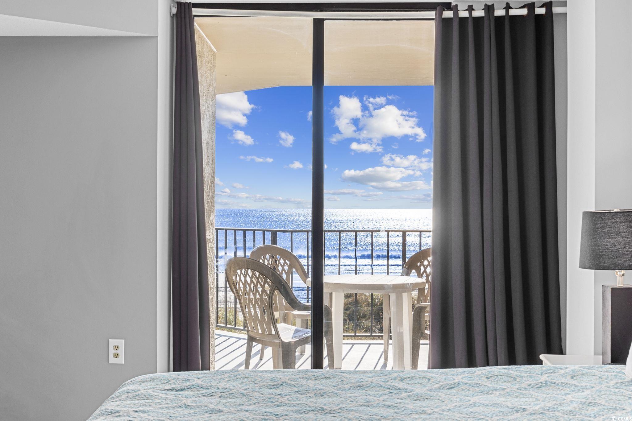 4701 South Ocean Boulevard, Unit 2B North Myrtle Beach, SC 29582 - Photo 12 of 31 Bedroom featuring a water view and access to exterior