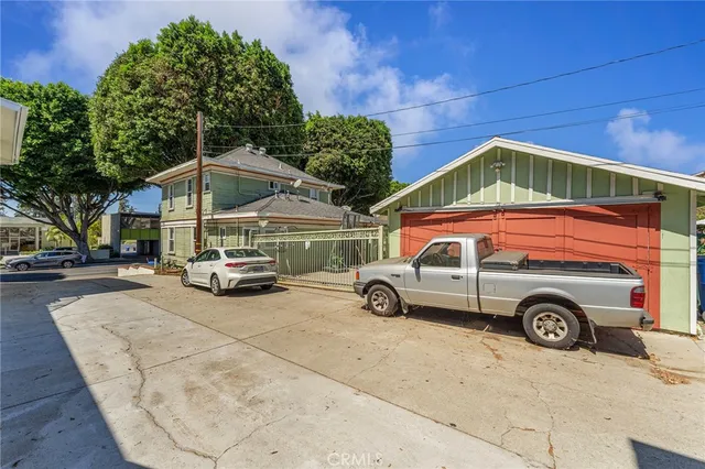 a view of a car parked in front of a house