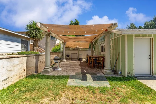 a view of a backyard with a patio