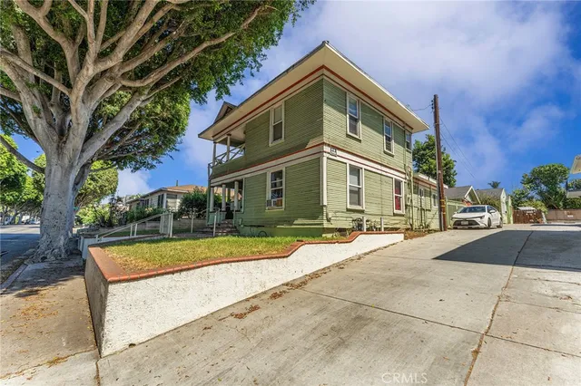 a view of a white building with a large windows