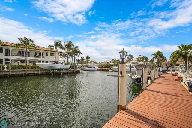 a view of a lake with boats and trees in the background