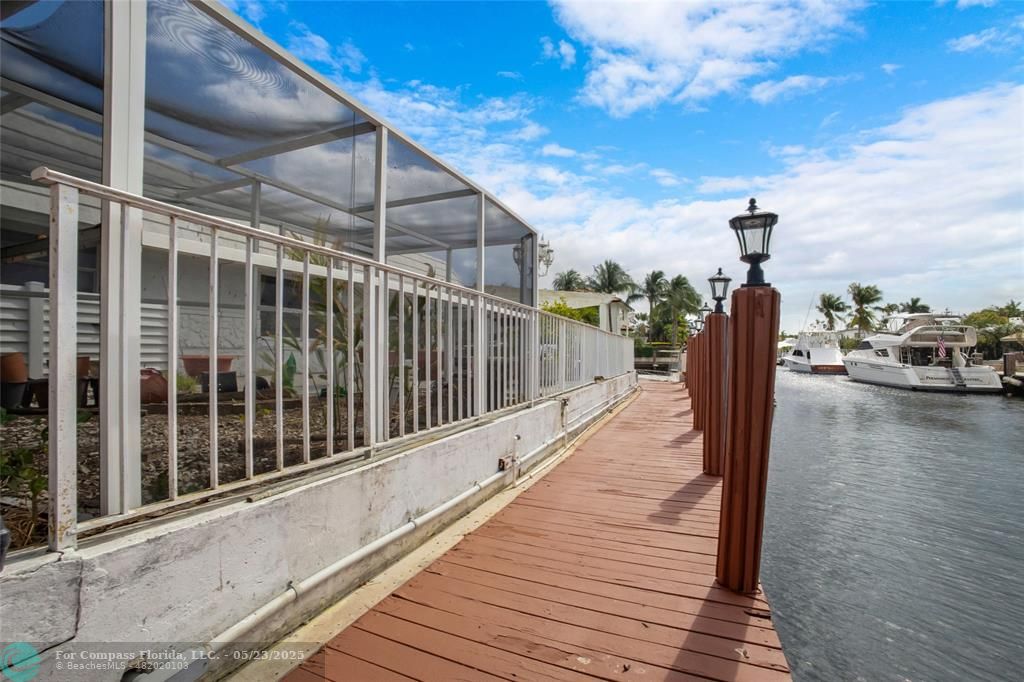 1311 Northeast 27th Way Pompano Beach, FL 33062 - Photo 16 of 58 a view of a balcony with staircase