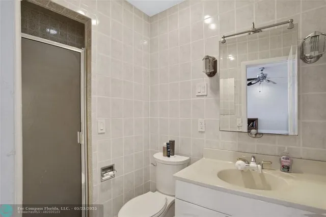 a bathroom with a sink a bath tub and shower