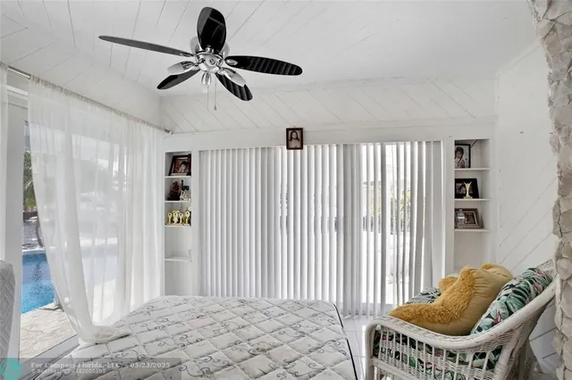 a car parked in front of white house