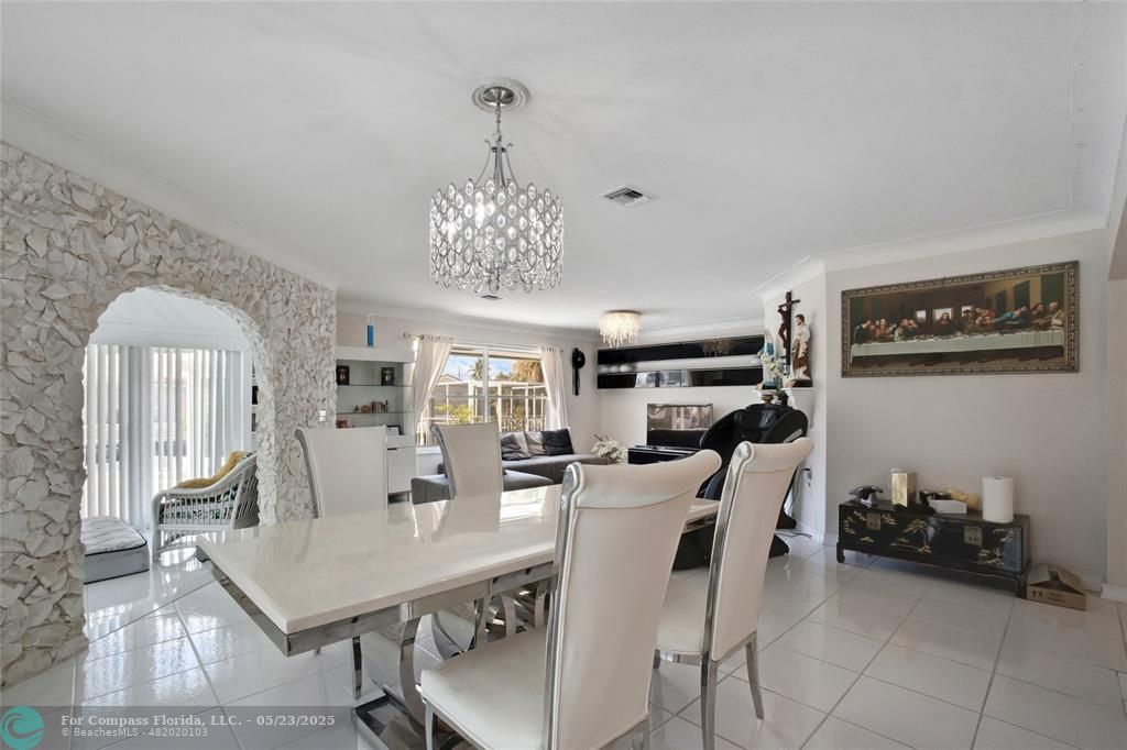 1311 Northeast 27th Way Pompano Beach, FL 33062 - Photo 30 of 58 a view of a dining room with furniture