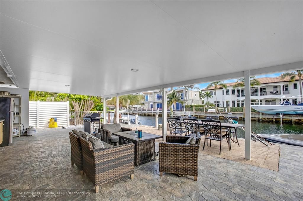 1311 Northeast 27th Way Pompano Beach, FL 33062 - Photo 3 of 58 a living room with furniture and a table