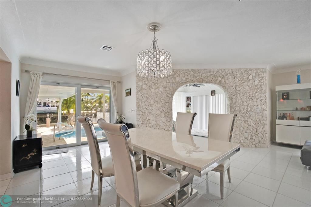 1311 Northeast 27th Way Pompano Beach, FL 33062 - Photo 31 of 58 a view of a dining room with furniture window and outside view