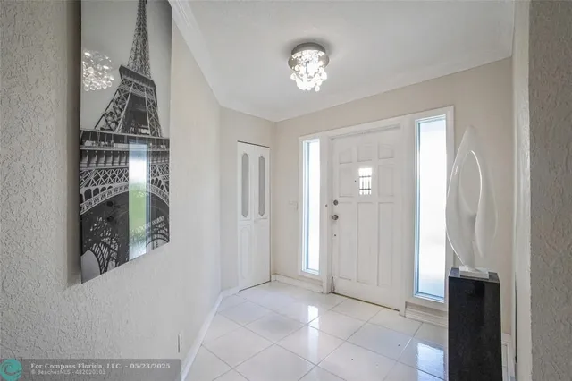 a kitchen with appliances a sink and cabinets