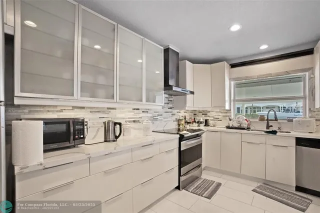 a living room with furniture a gym equipment and a large window