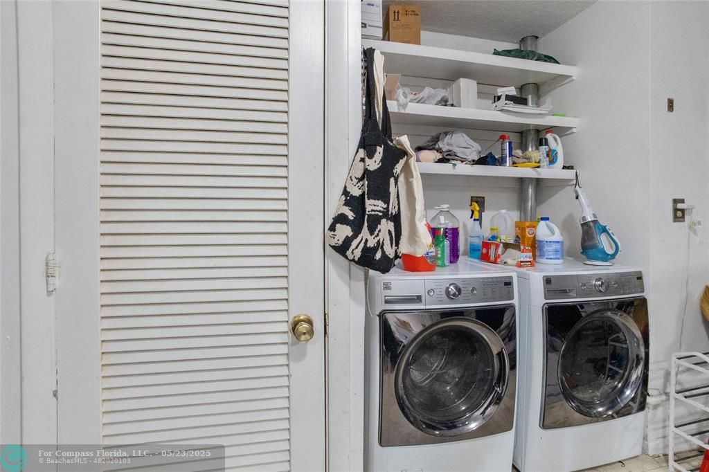 1311 Northeast 27th Way Pompano Beach, FL 33062 - Photo 58 of 58 a view of a storage and utility room with washer and dryer