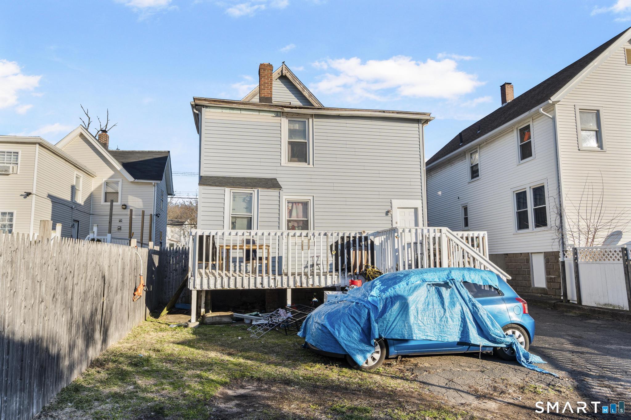 48 Fulton Street New Haven, CT 06513 - Photo 14 of 16 a view of a house with a yard and deck