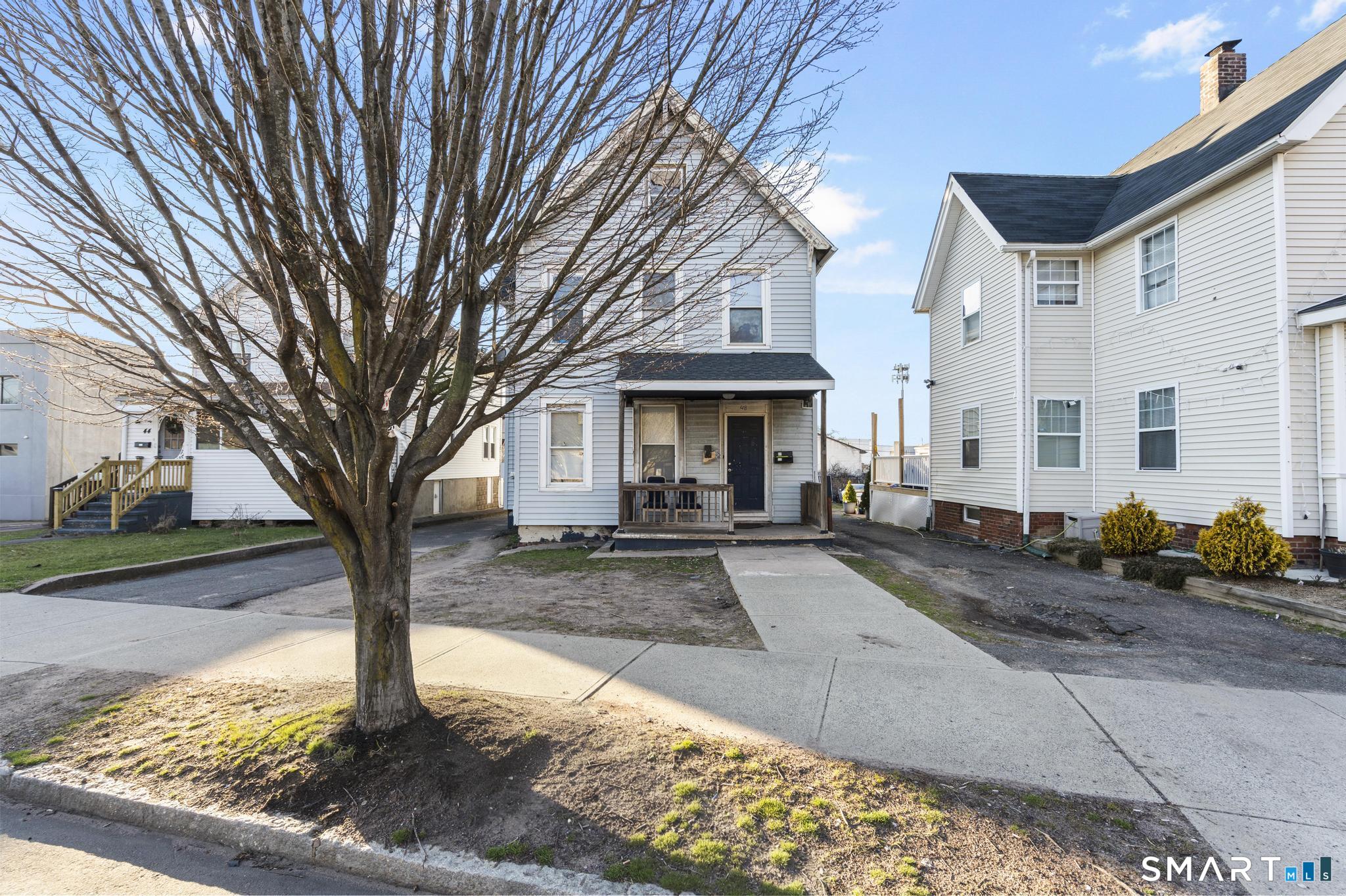 48 Fulton Street New Haven, CT 06513 - Photo 2 of 16 a front view of a house with garden