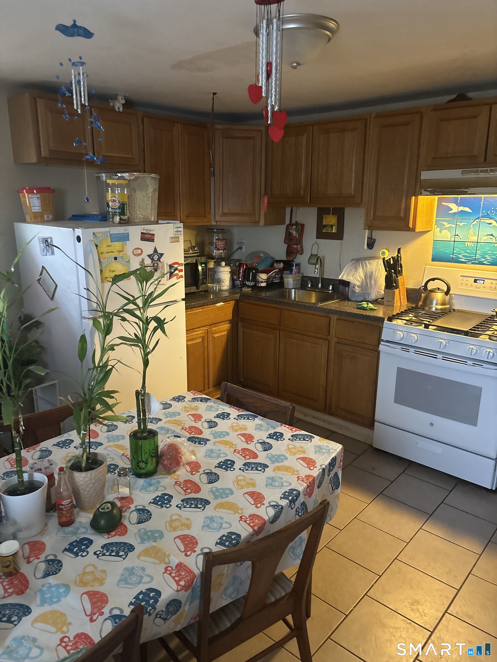 48 Fulton Street New Haven, CT 06513 - Photo 7 of 16 a kitchen with kitchen island a sink stove and refrigerator