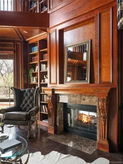 a living room with furniture a window and a fireplace