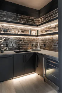 a kitchen with stainless steel appliances granite countertop a stove and a sink