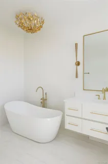 a bathroom with a bathtub and a sink