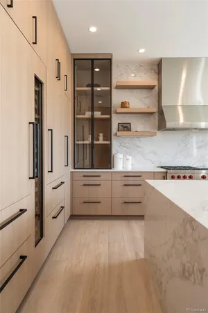 a view of counter top space and window in kitchen