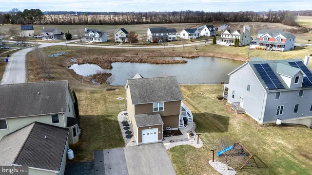 a view of a house with outdoor space and sitting area