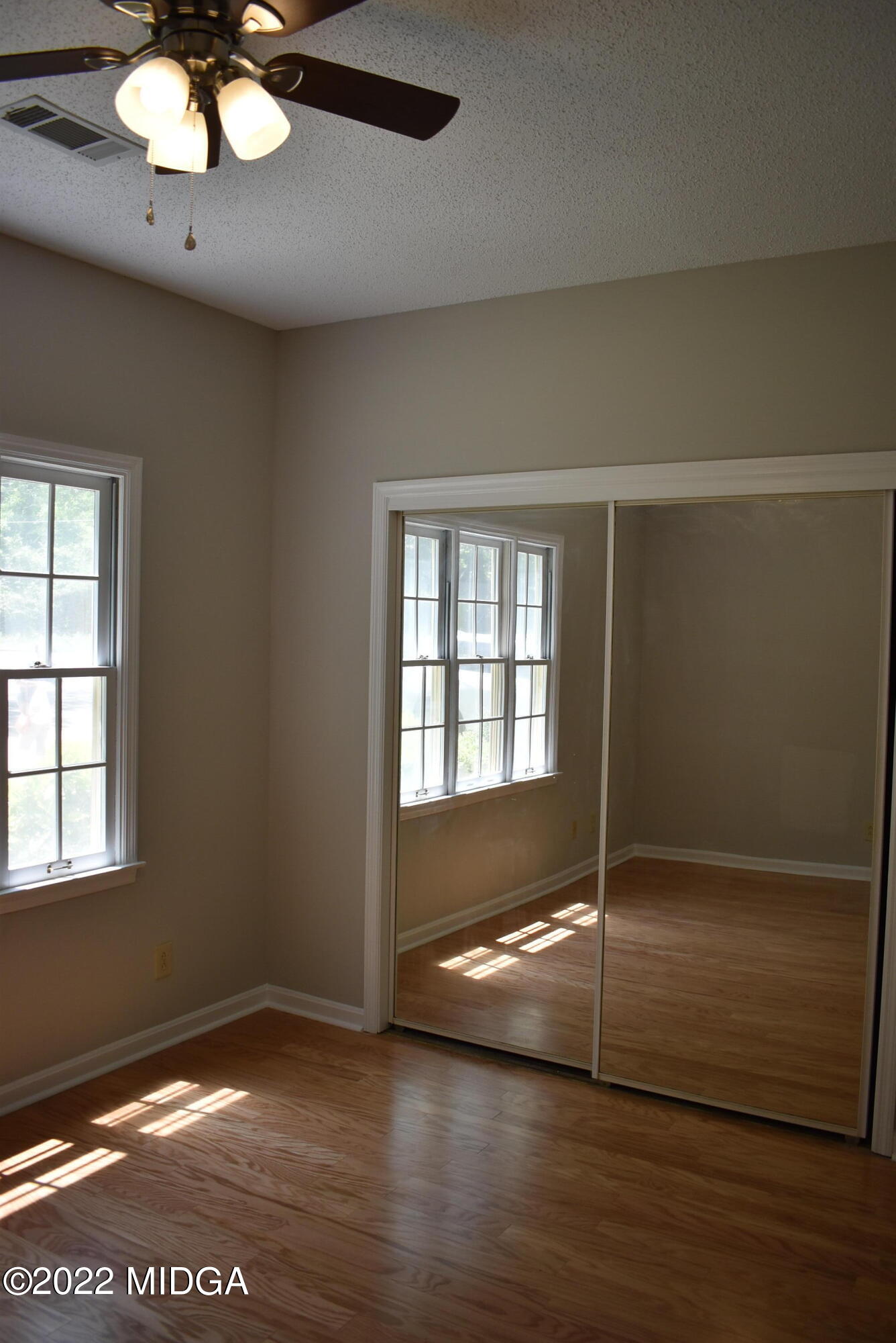 914 Lundy Terrace Macon, GA 31210 - Photo 13 of 15 an empty room with wooden floor and windows