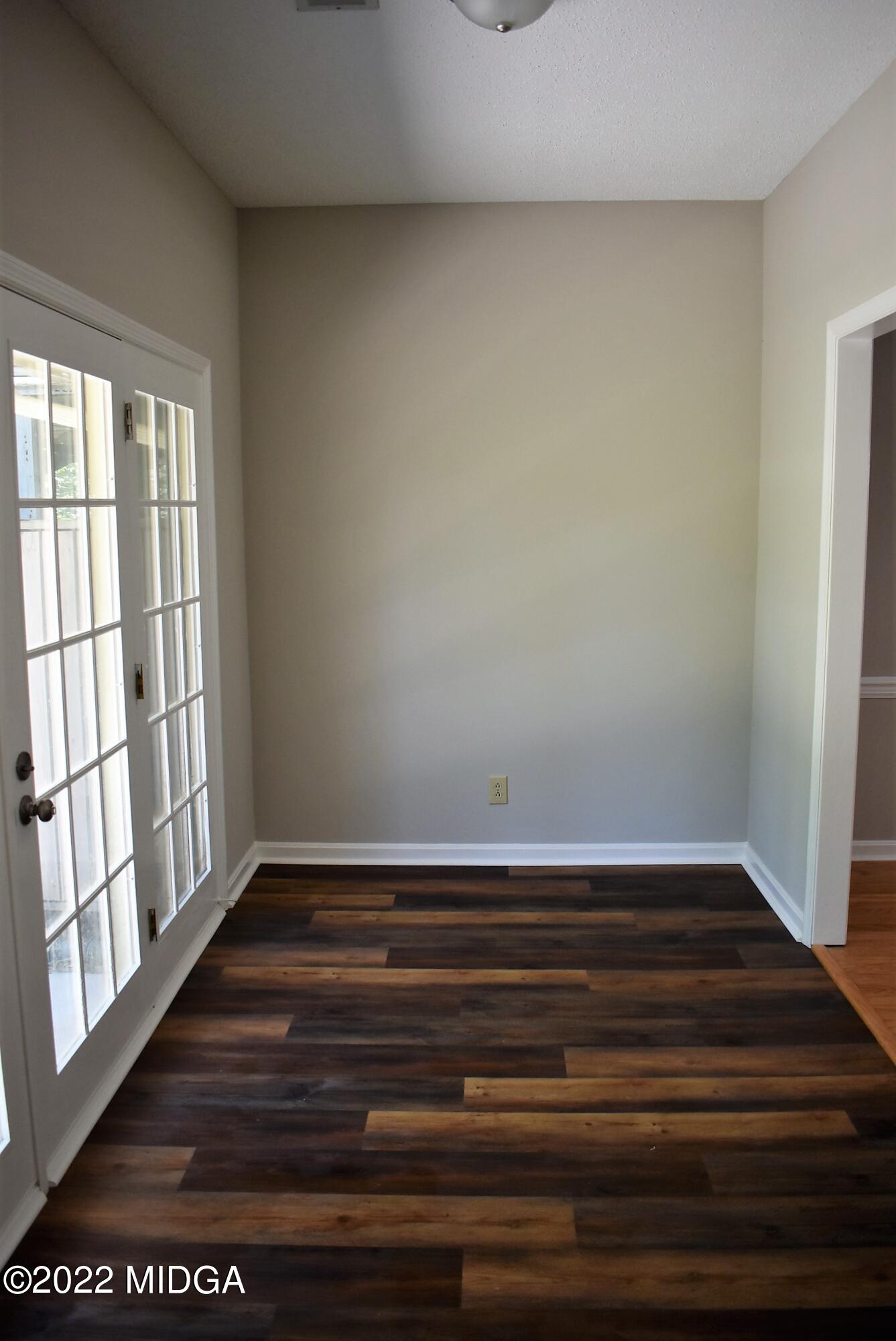 914 Lundy Terrace Macon, GA 31210 - Photo 15 of 15 a view of wooden floor and windows in a room