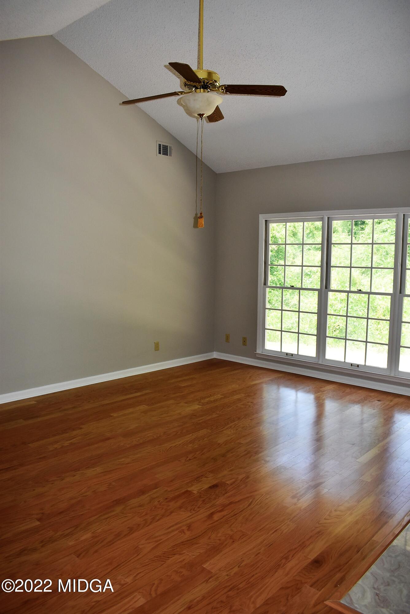 914 Lundy Terrace Macon, GA 31210 - Photo 3 of 15 wooden floor in an empty room with a window