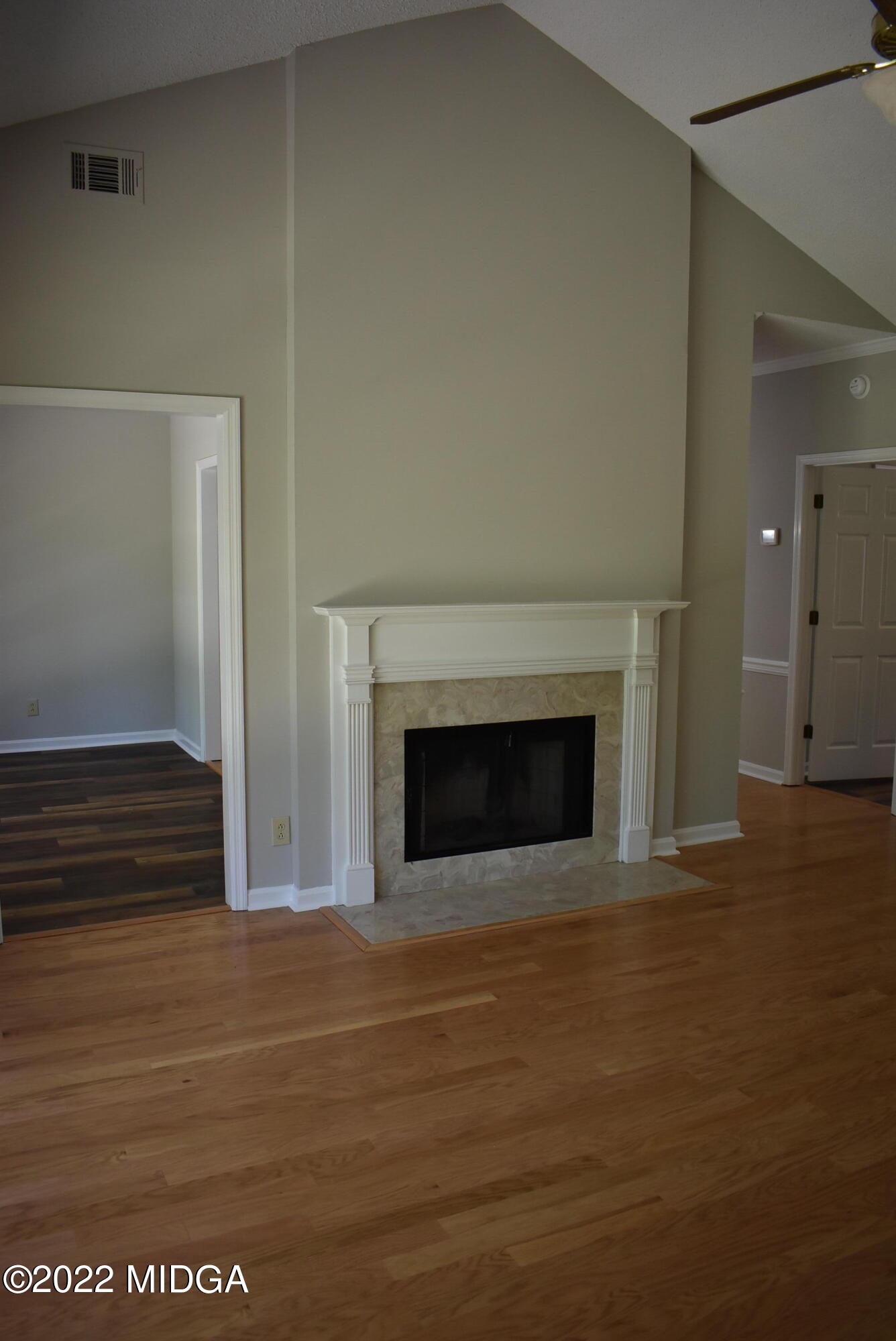 914 Lundy Terrace Macon, GA 31210 - Photo 5 of 15 a view of a livingroom with wooden floor and a fireplace