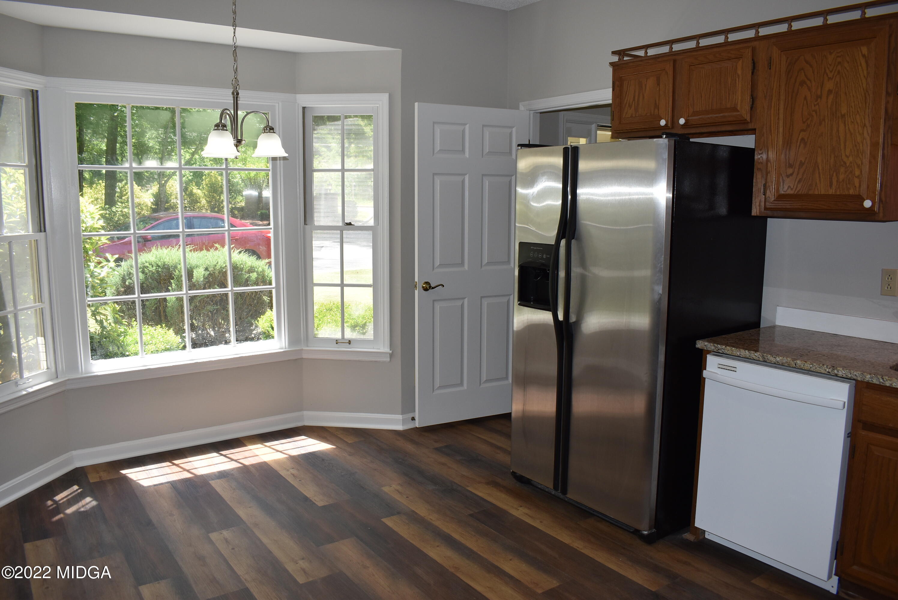 914 Lundy Terrace Macon, GA 31210 - Photo 7 of 15 a kitchen with stainless steel appliances granite countertop a refrigerator a sink and a window