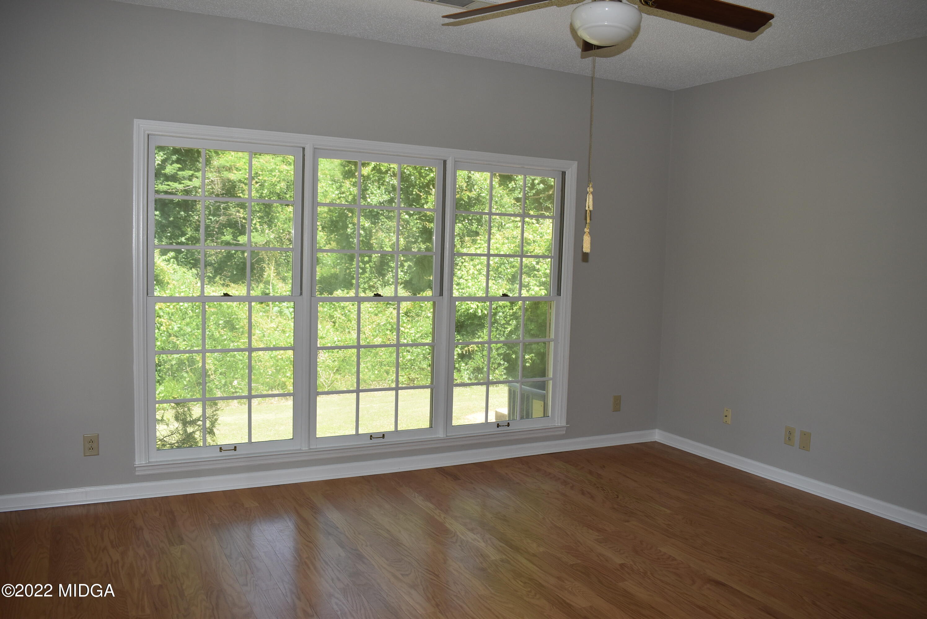 914 Lundy Terrace Macon, GA 31210 - Photo 10 of 15 a view of an empty room with wooden floor and windows