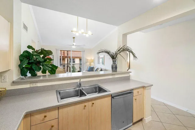 a kitchen with a sink and a window