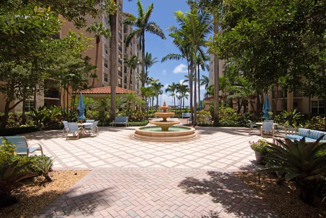 a view of a fountain with sitting area