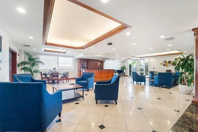 a living room with lots of furniture and clutter