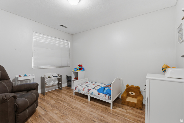 282 West 960 South, Unit C Provo, UT 84601 - Photo 24 of 33 Bedroom featuring light wood-style floors