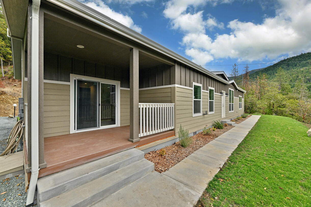 5572 Jumpoff Joe Creek Road Grants Pass, OR 97526 - Photo 37 of 38 a front view of a house with garden