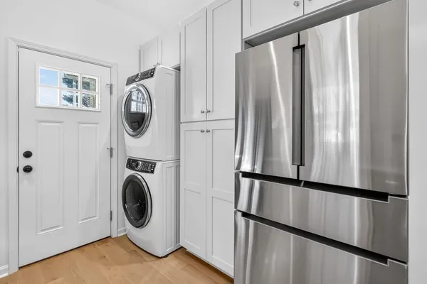 a view of a hallway with washer and dryer