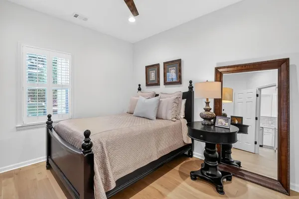 a bed room with a bed and a desk