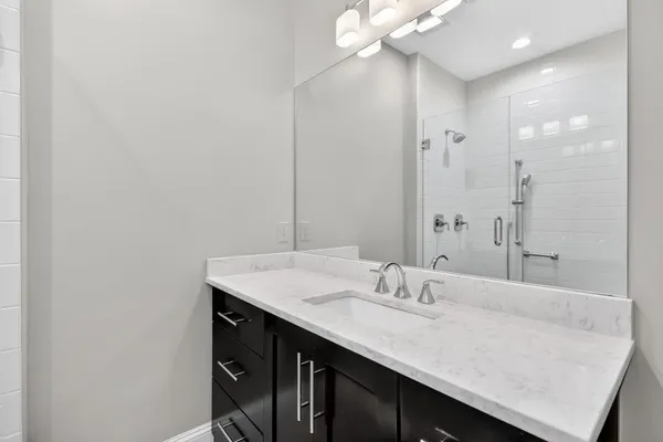 a bathroom with a sink and a mirror