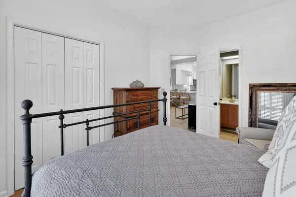a room with a bed and cabinets