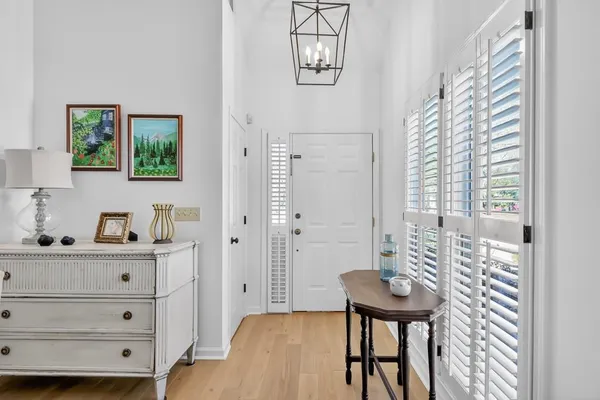a view of a bedroom with furniture and windows