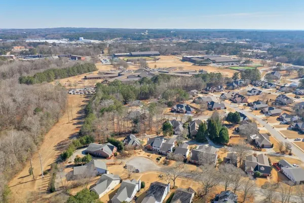an aerial view of residential houses with outdoor space