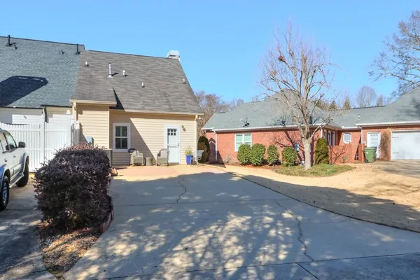 a view of a house with a yard and garage
