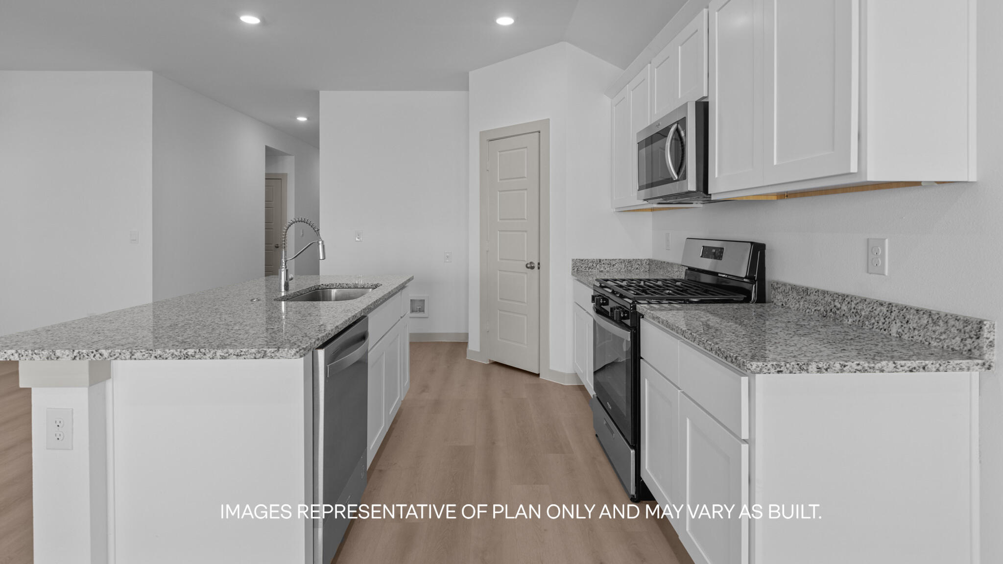218 14th Street Wolfforth, TX 79382 - Photo 4 of 14 a kitchen with stainless steel appliances granite countertop a sink stove and cabinets