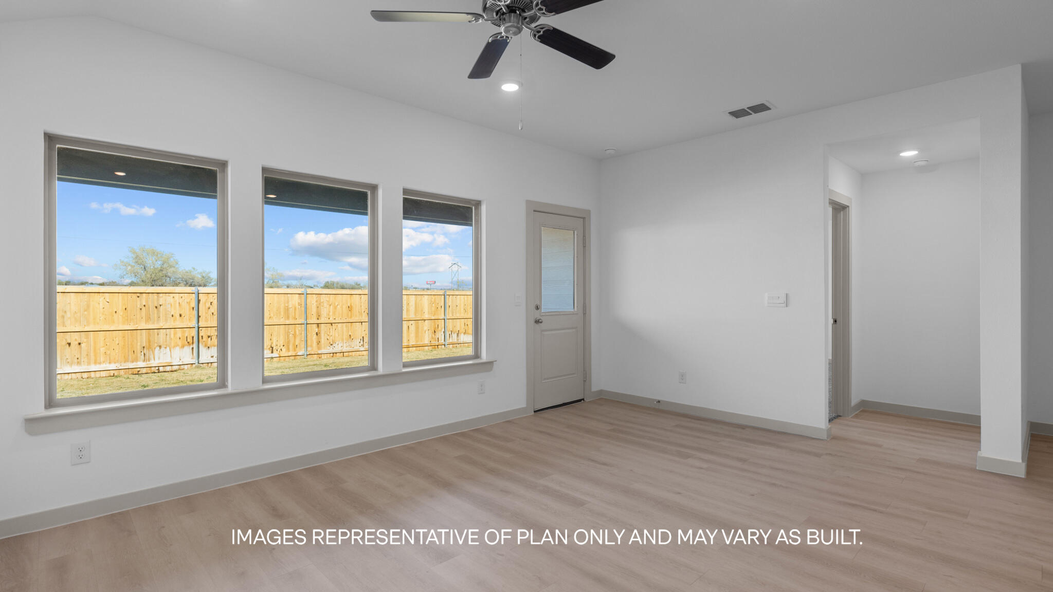 218 14th Street Wolfforth, TX 79382 - Photo 6 of 14 a view of an empty room with a window and wooden floor