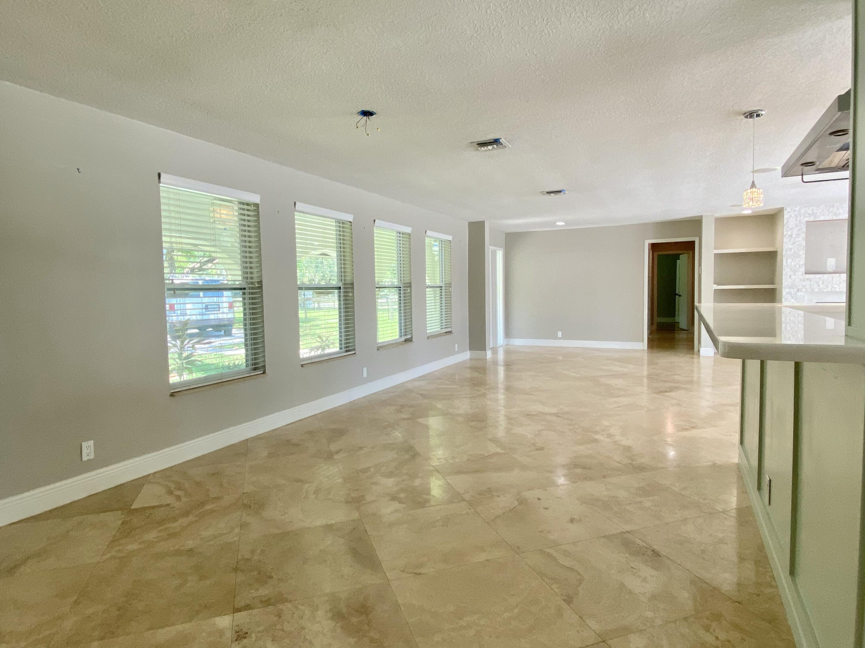 16605 115th Avenue North Jupiter, FL 33478 - Photo 18 of 54 a view of an empty room with a window
