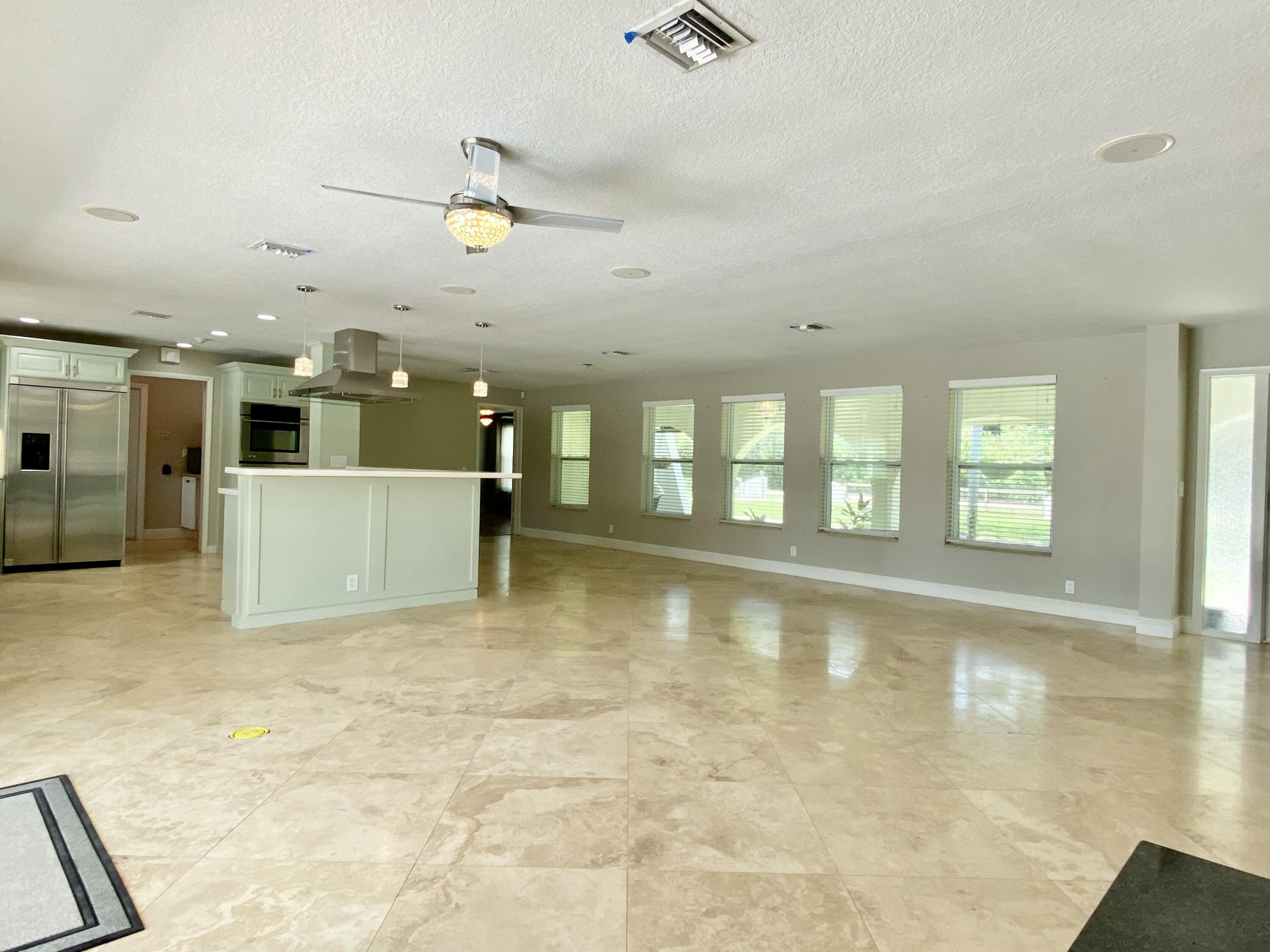 16605 115th Avenue North Jupiter, FL 33478 - Photo 19 of 54 a view of a kitchen with a sink and cabinets