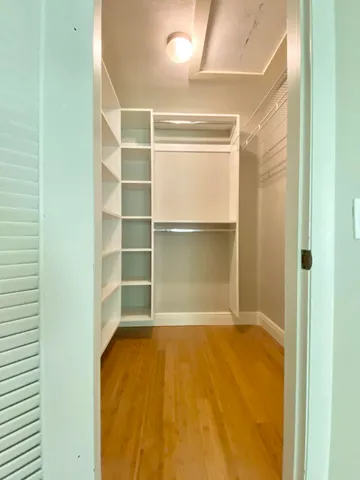 a bathroom with a shower and a toilet