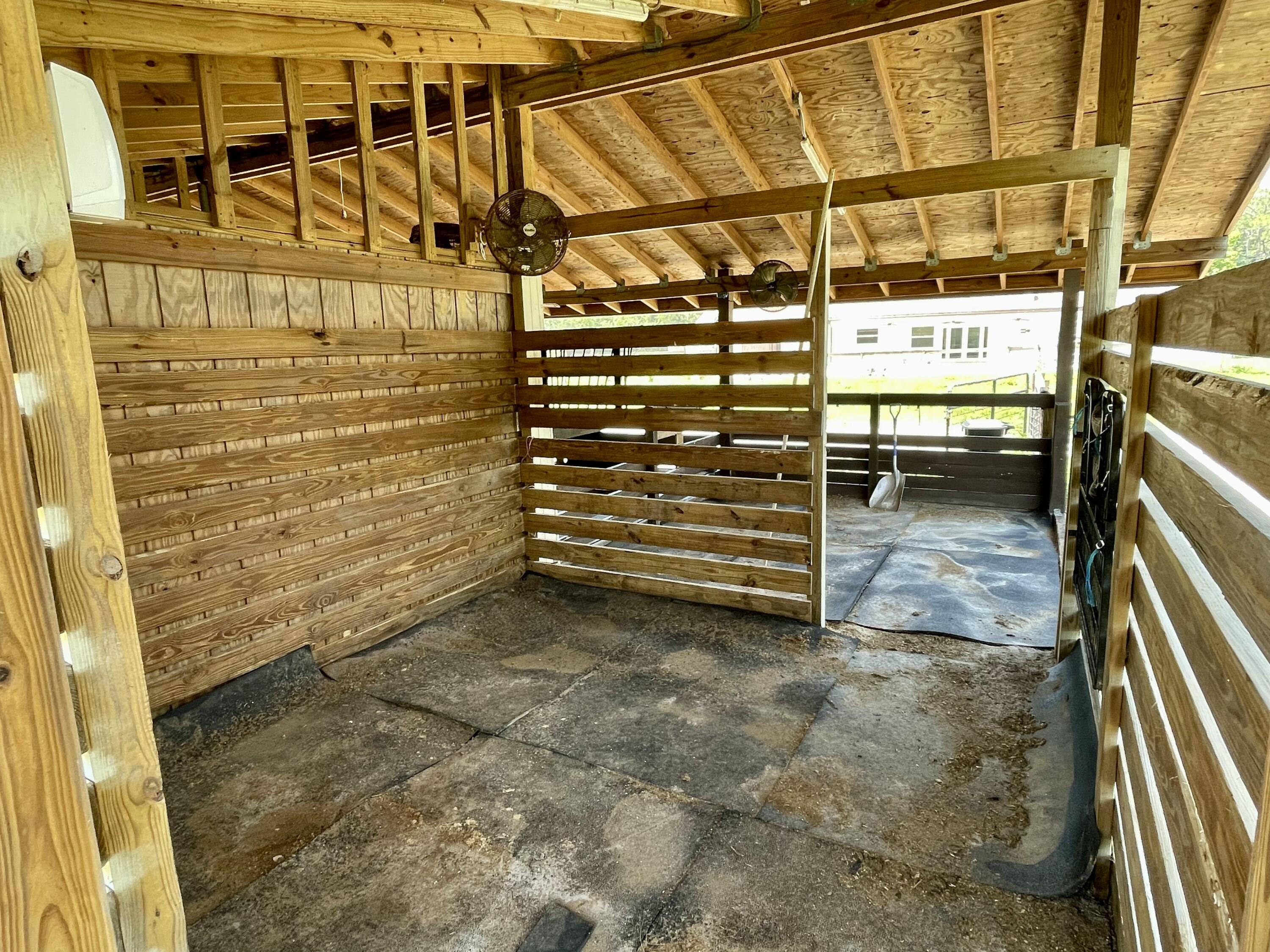 16605 115th Avenue North Jupiter, FL 33478 - Photo 47 of 54 a view of a room with racks on the wall