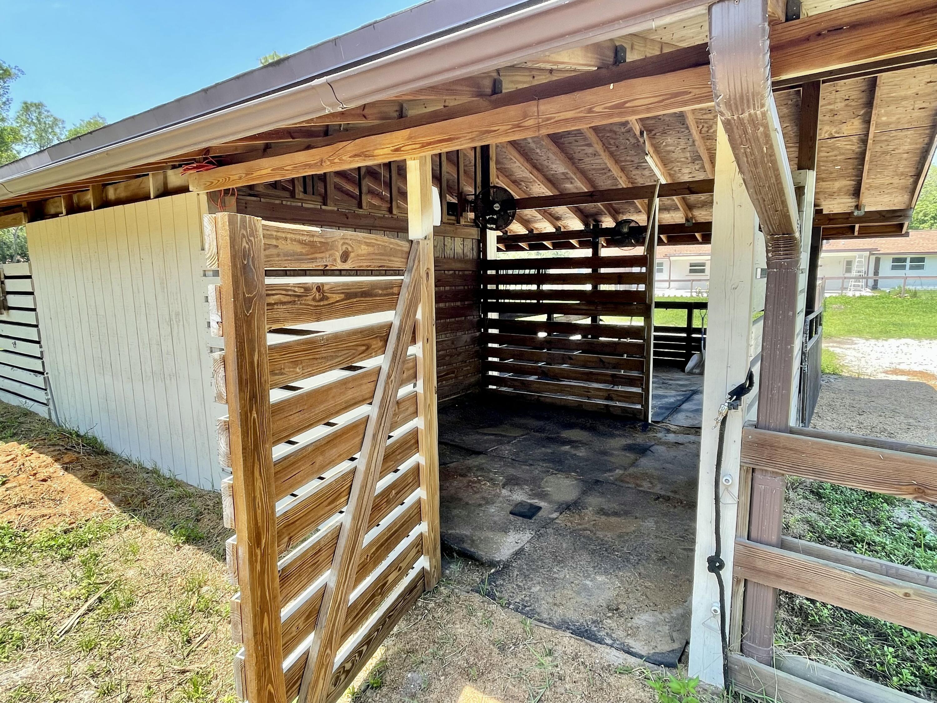 16605 115th Avenue North Jupiter, FL 33478 - Photo 48 of 54 a view of walk in closet with clothes and shoes