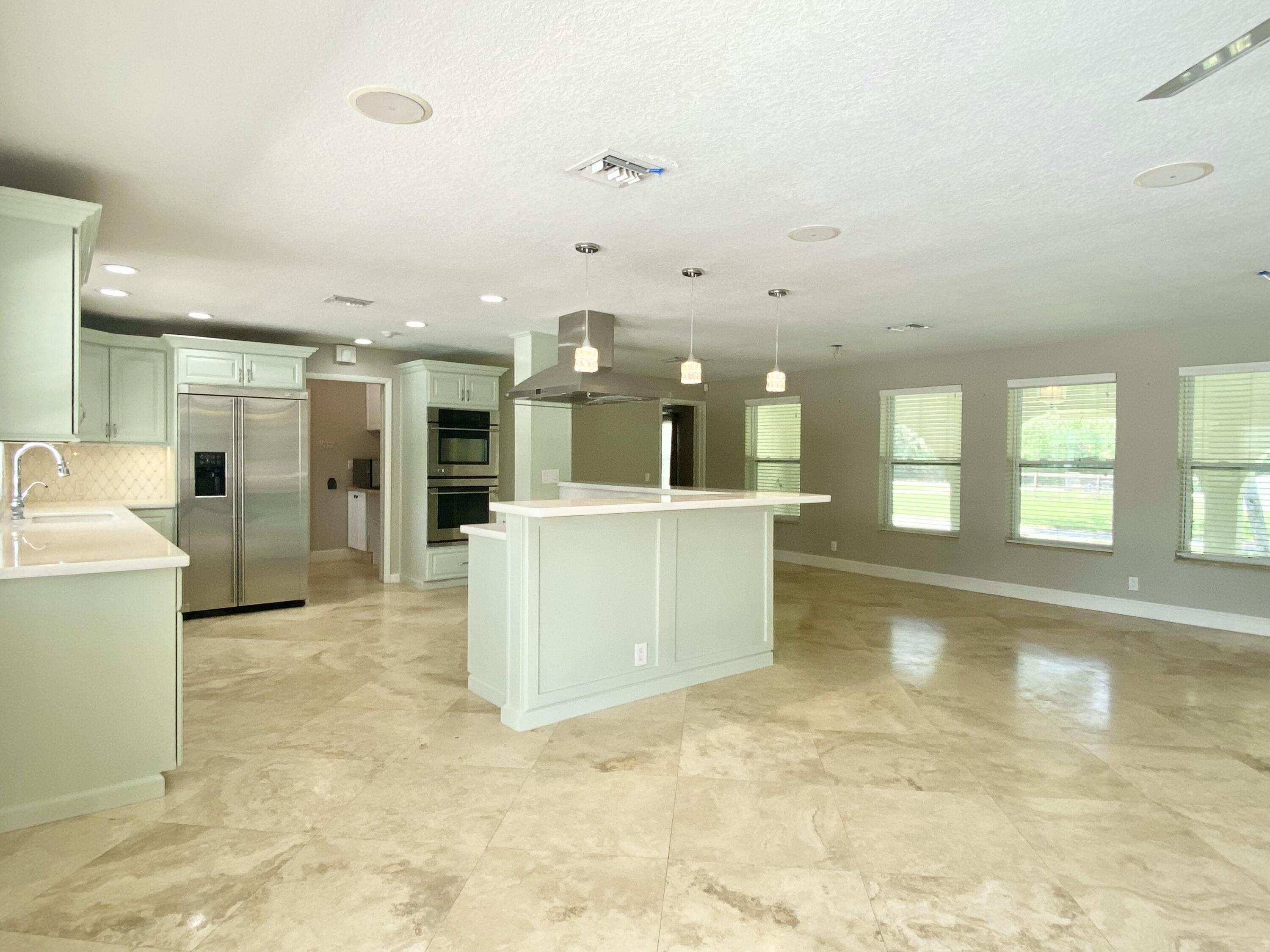 16605 115th Avenue North Jupiter, FL 33478 - Photo 8 of 54 a view of a kitchen with a sink