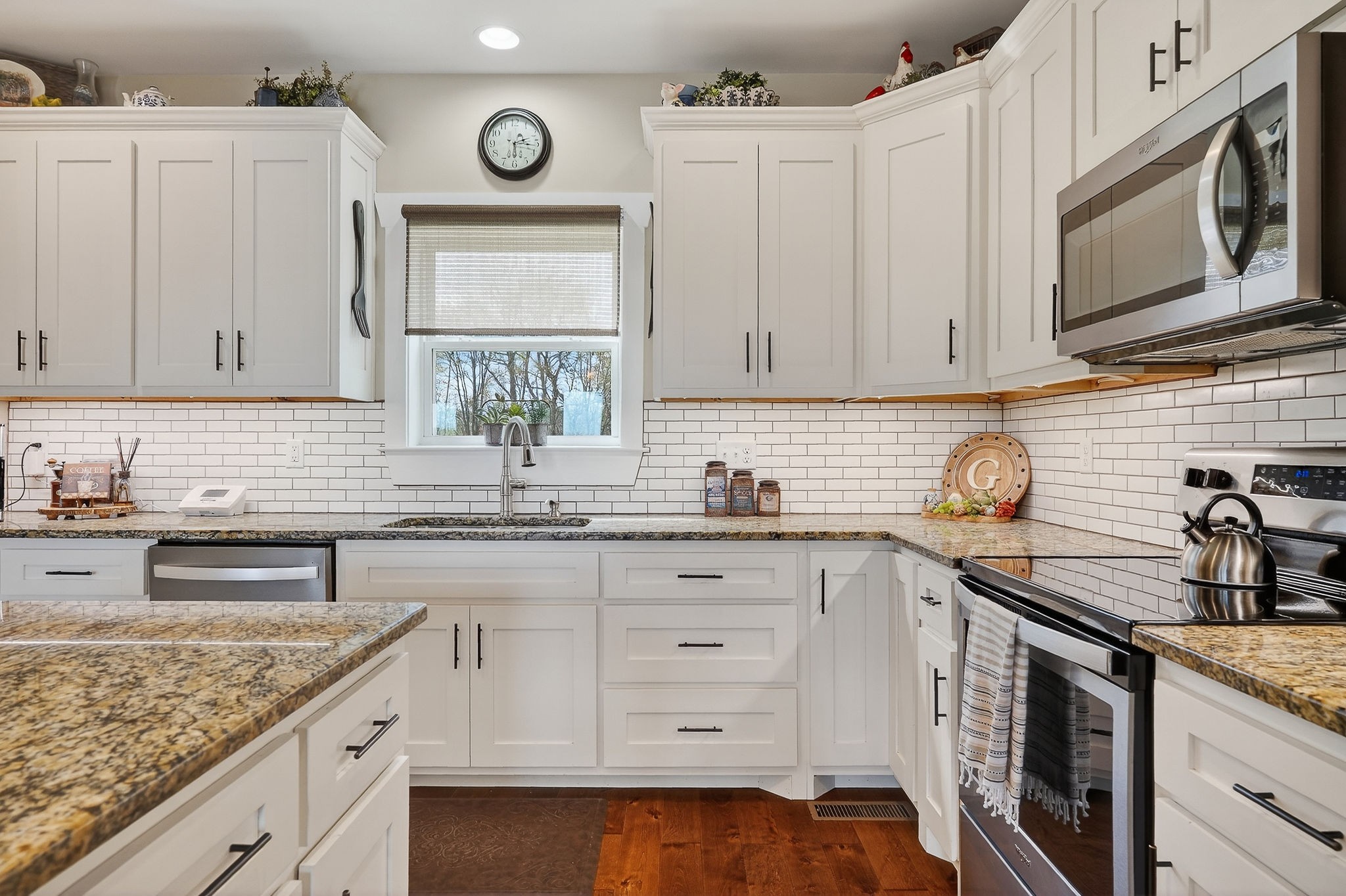 195 Coventry Way Smithville, TN 37166 - Photo 17 of 62 a kitchen with stainless steel appliances granite countertop a sink a stove and cabinets