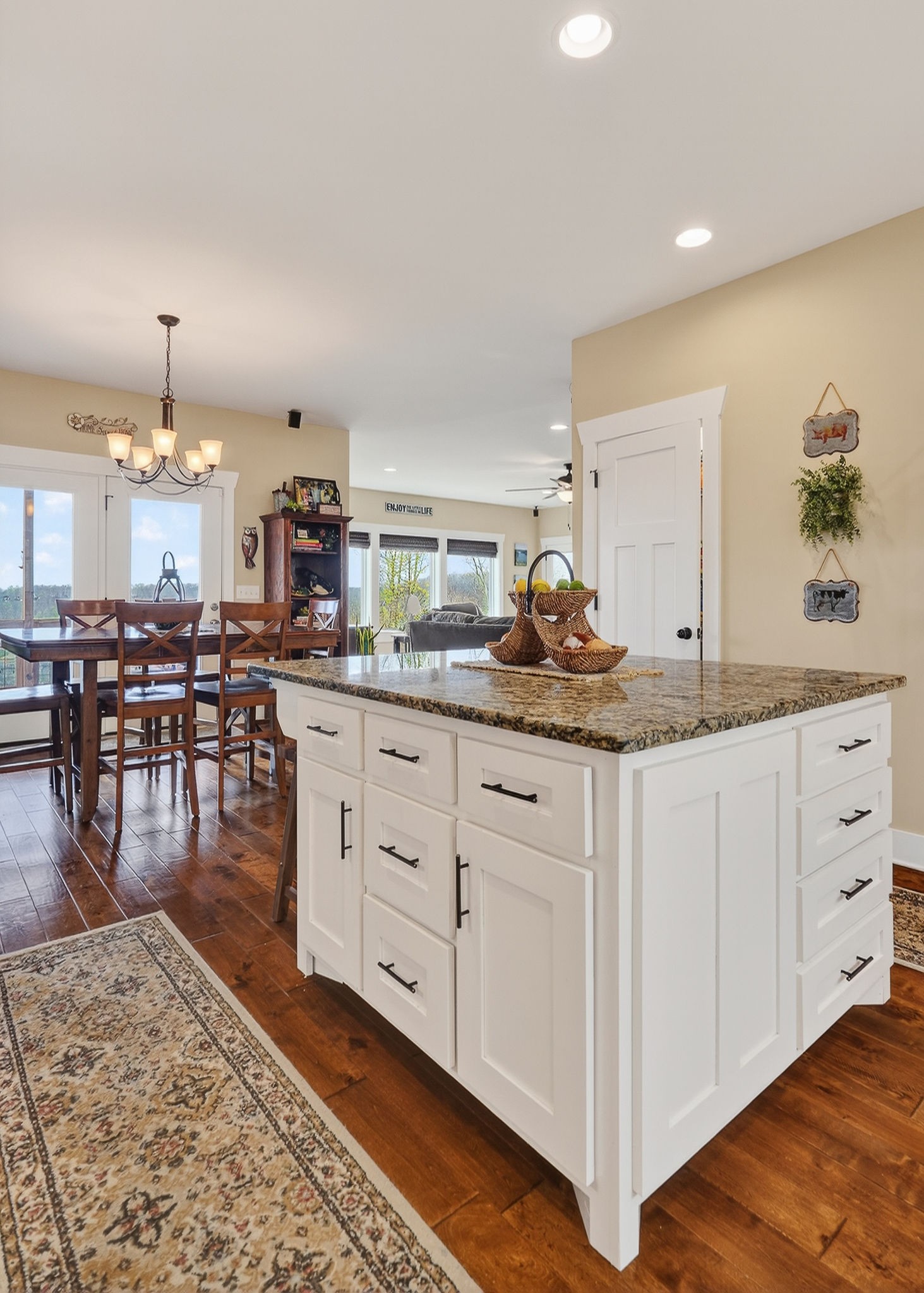 195 Coventry Way Smithville, TN 37166 - Photo 19 of 62 a kitchen with white cabinets and wooden floor